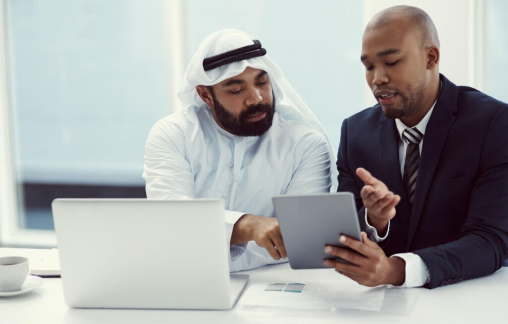 Business professionals discussing advisory and setup _c_onsultation_ in Saudi Arabia for successful company registration and growth.